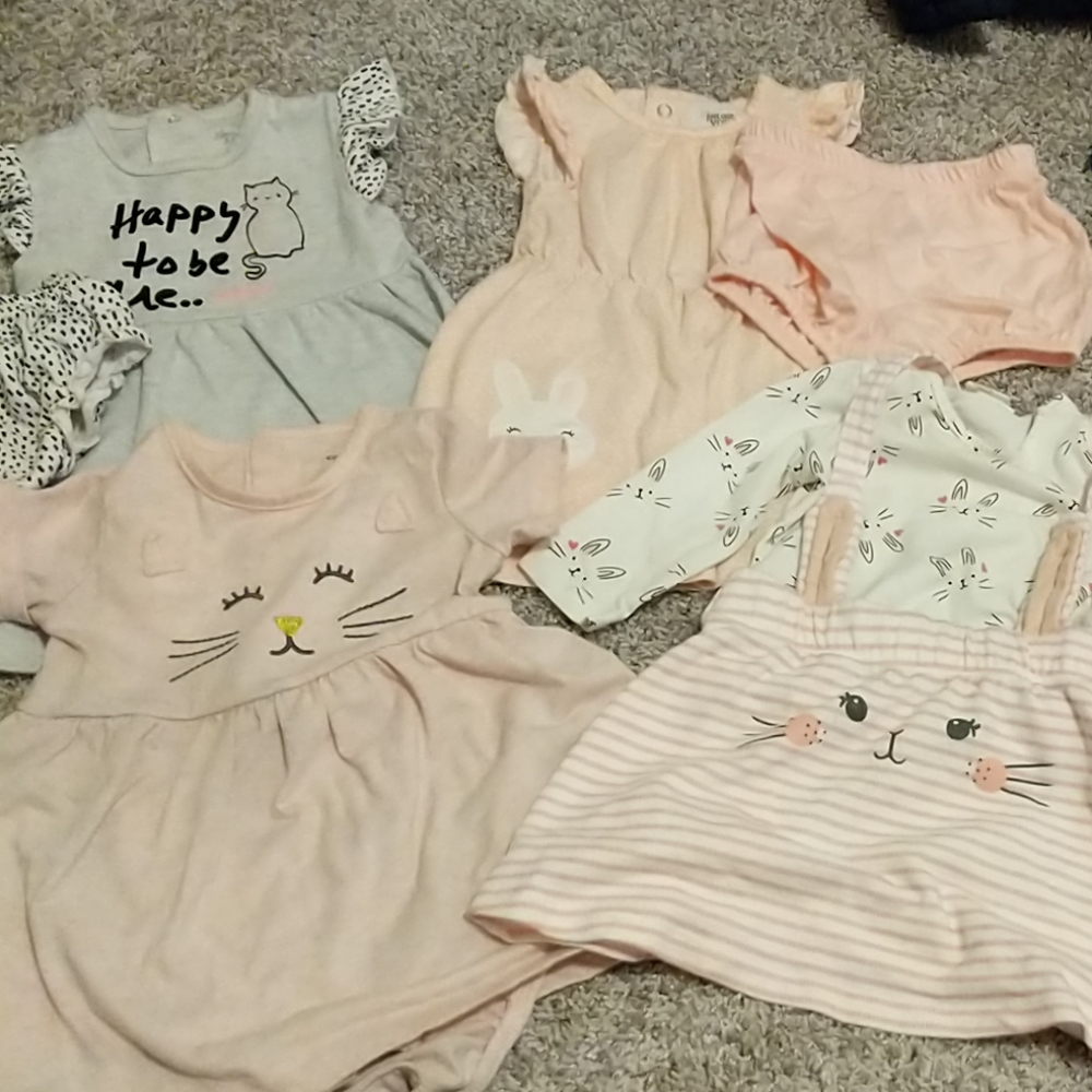 4 little girl dresses ranging from 4 to 12 months